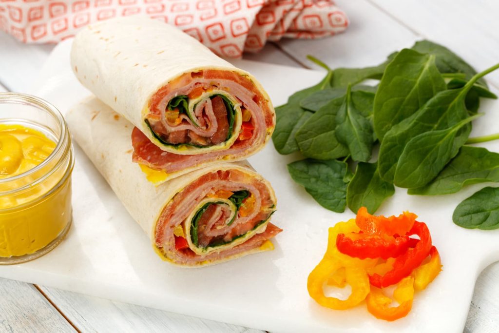 Lavash roll up on a cutting board.