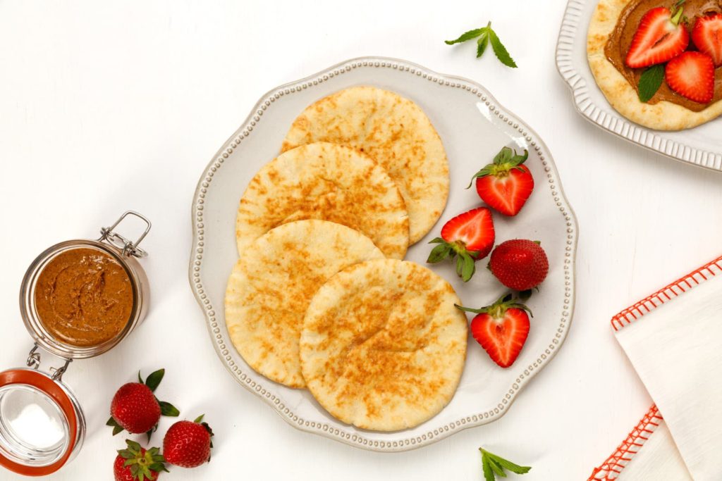 Some pita with strawberries and a chocolate hazelnut spread.