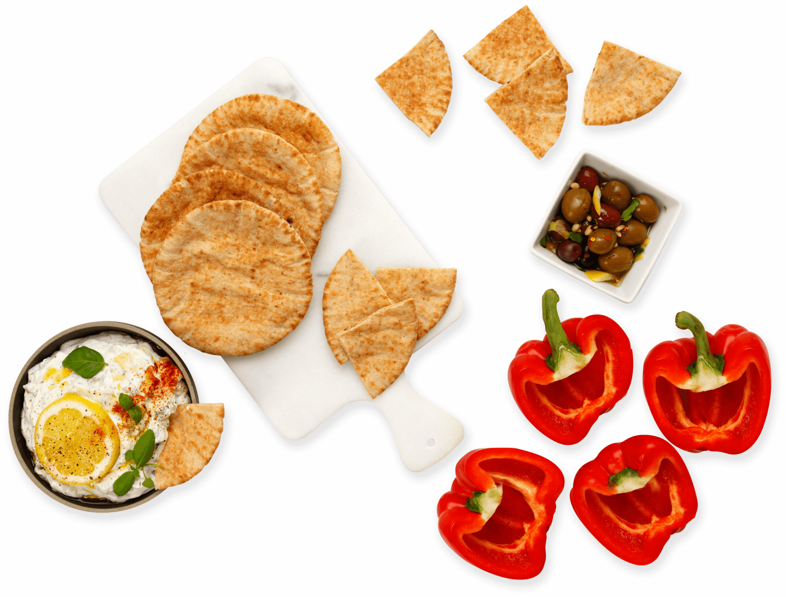 Various foods lying on a white table.